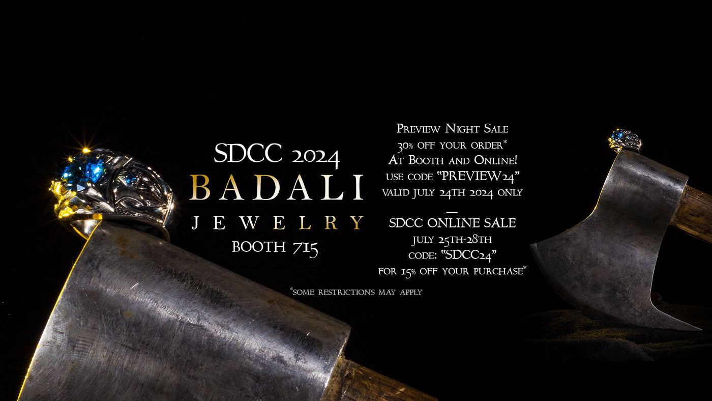 The Badali Dol Guldor Ring sits on an Axe on a black background with text that reads: "SDCC2024 Badali Jewelry Booth 715. SDCC Preview Night Sale: Use Code PREIVEW24 for 30% off your entire purchase*  July 24th ONLY | SDCC Online Sale: Use Code SDCC24 for 15 % off your total purchase* July 25th-28th 2024  | *Some restrictions may apply"